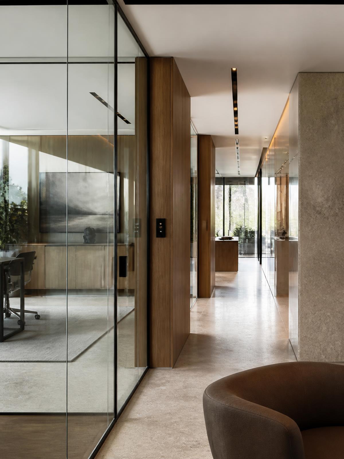 Contemporary office with frameless glass partitioning
